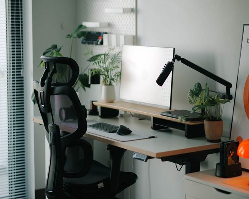 A neat desk workspace with high ergonomic arrangement features